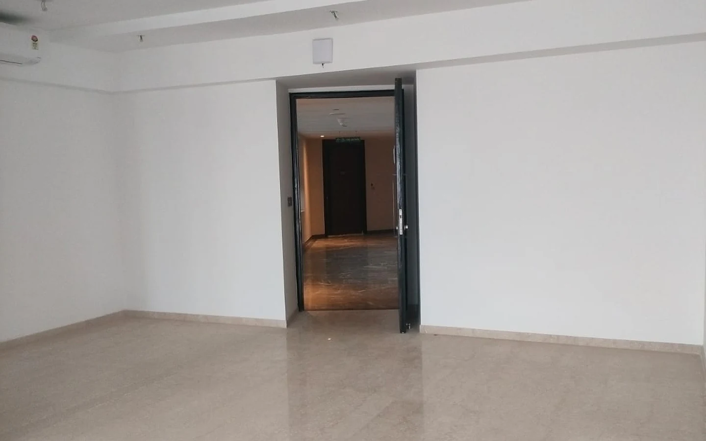 Living room with marble flooring and main entrance door in 3 BHK apartment for rent at Lodha Park Tower Adrina, Worli
