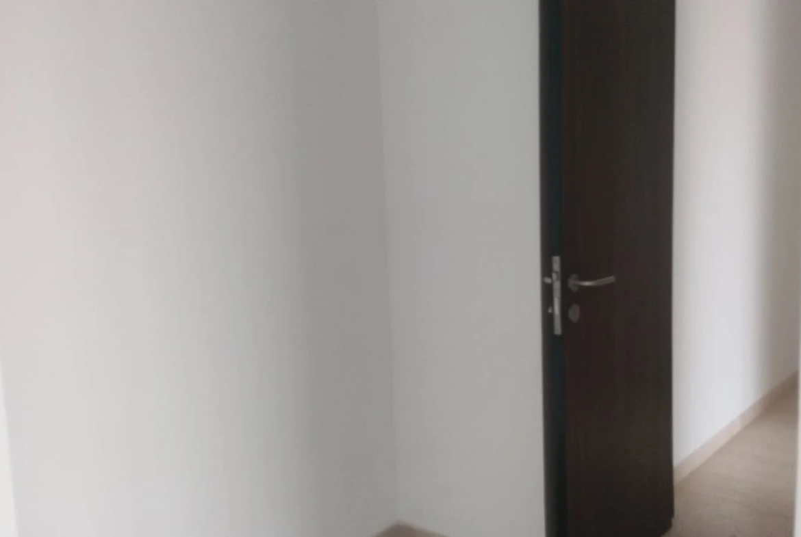 Bedroom entrance with marble flooring and wooden door in 3 BHK at Lodha Park Tower Adrina, Worli