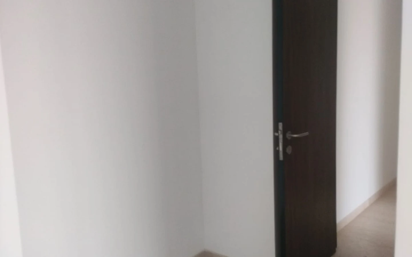 Bedroom entrance with marble flooring and wooden door in 3 BHK at Lodha Park Tower Adrina, Worli
