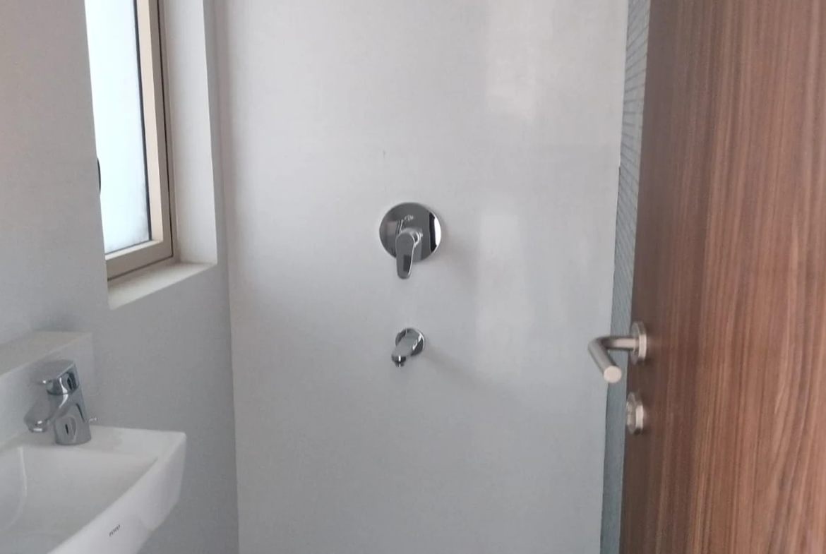 Bathroom with rain shower, wall-mounted basin and window in 3 BHK at Lodha Park Tower Adrina, Worli