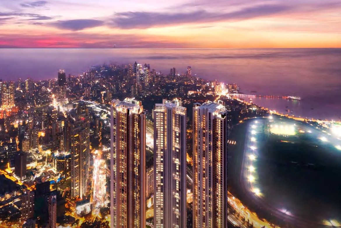 Night aerial view of Piramal Mahalaxmi towers beside the illuminated Mahalaxmi Racecourse, South Mumbai