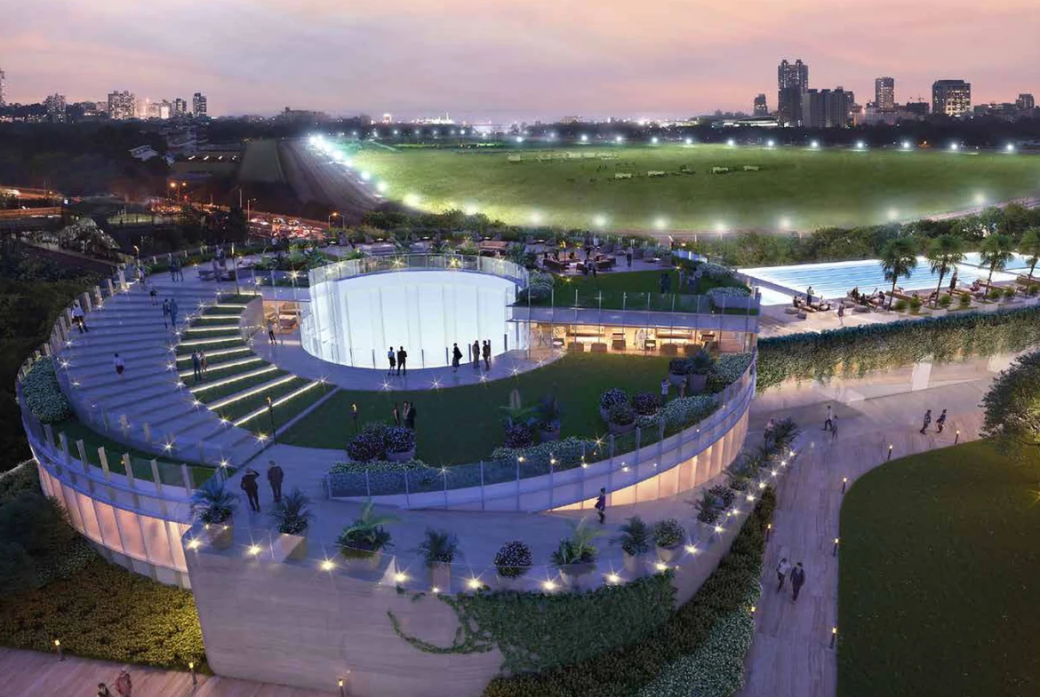 Circular podium clubhouse at night next to Mahalaxmi Racecourse at Piramal Mahalaxmi, South Mumbai