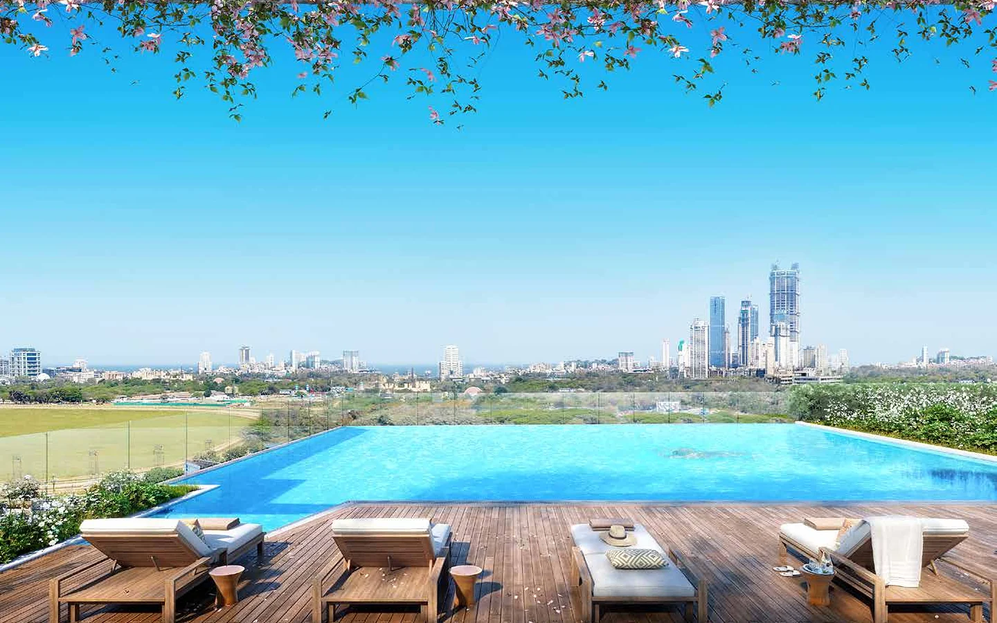 Infinity-edge swimming pool with sun deck and racecourse and city view at Piramal Mahalaxmi, South Mumbai