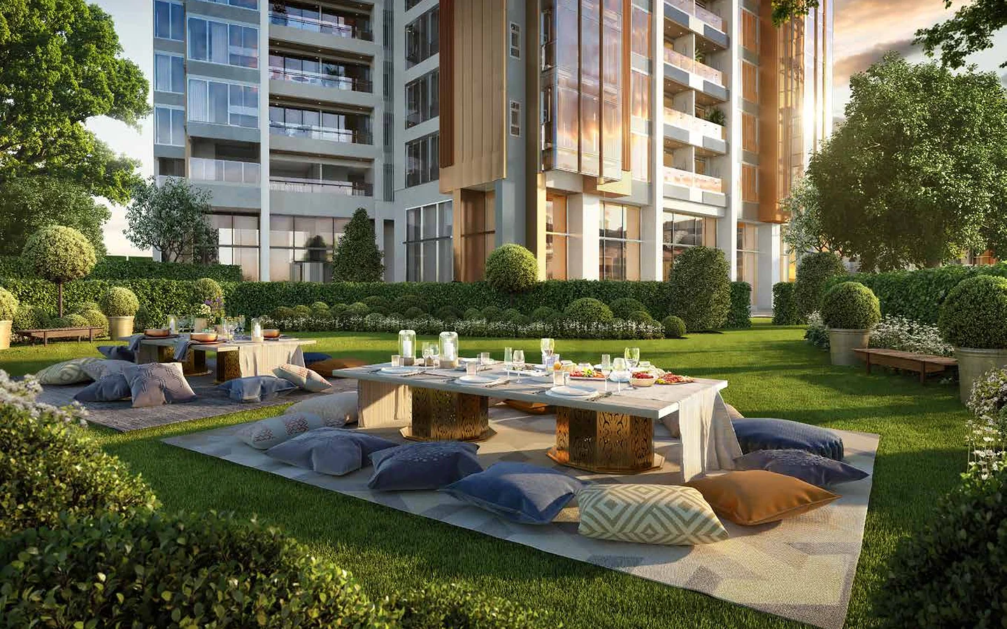 Landscaped grand lawn with outdoor dining and lounge seating at Piramal Mahalaxmi, South Mumbai