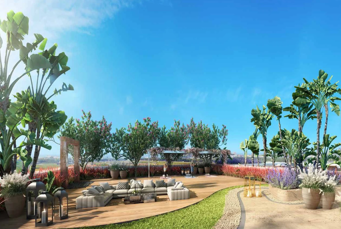 Landscaped podium garden with palms, flowering plants and seating areas at Piramal Mahalaxmi, South Mumbai