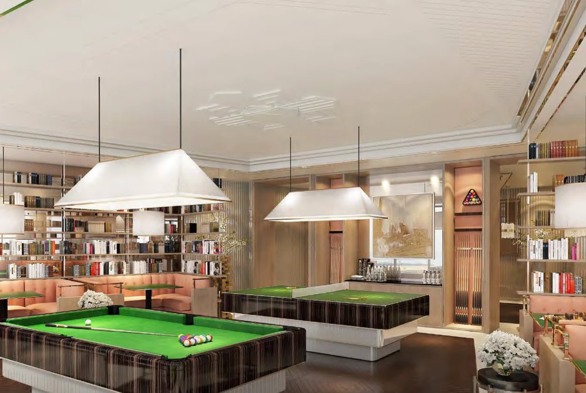 Games room with pool tables and lounge seating at Piramal Mahalaxmi, South Mumbai