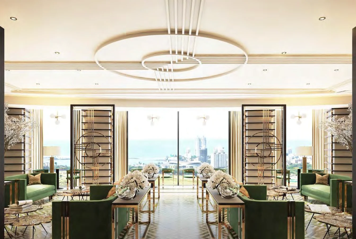 Luxury lounge with designer seating and city view windows at Piramal Mahalaxmi, South Mumbai