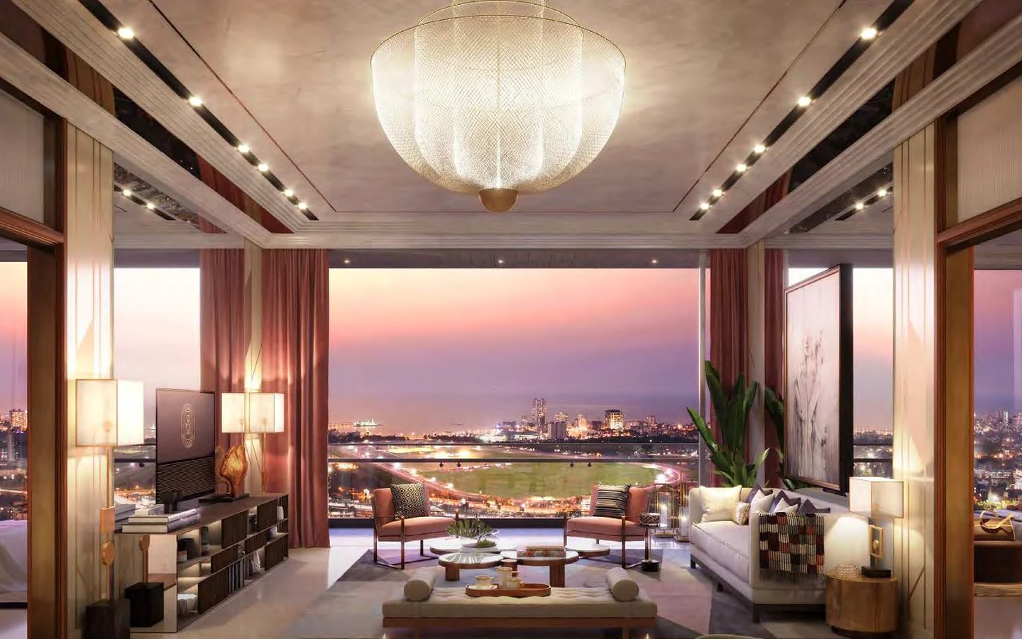 Sample living and dining room with chandelier and racecourse and sea view at dusk at Piramal Mahalaxmi, South Mumbai