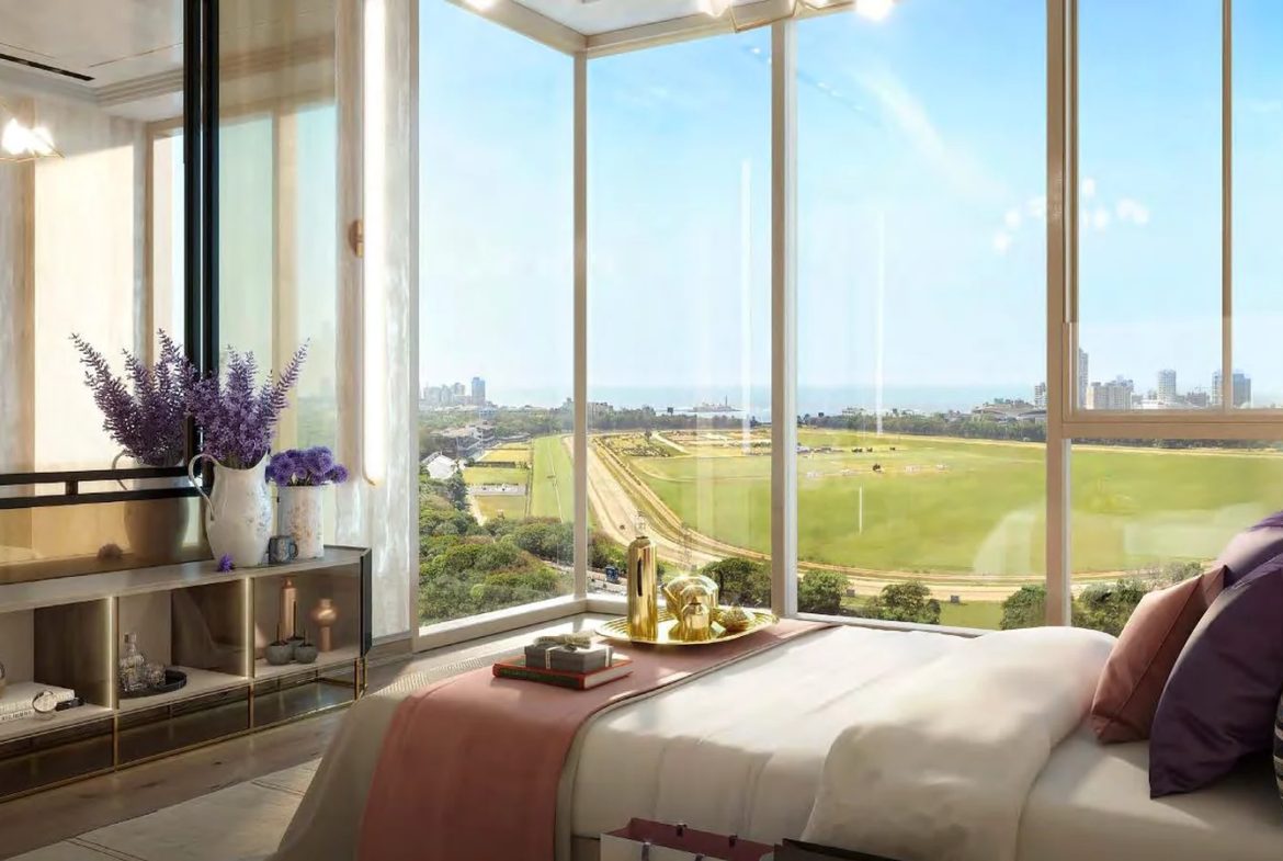 Sample master bedroom with corner glass windows overlooking Mahalaxmi Racecourse at Piramal Mahalaxmi, South Mumbai