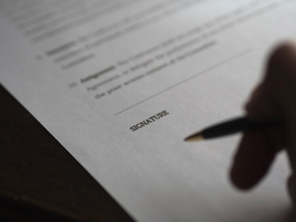 Signing a property agreement document
